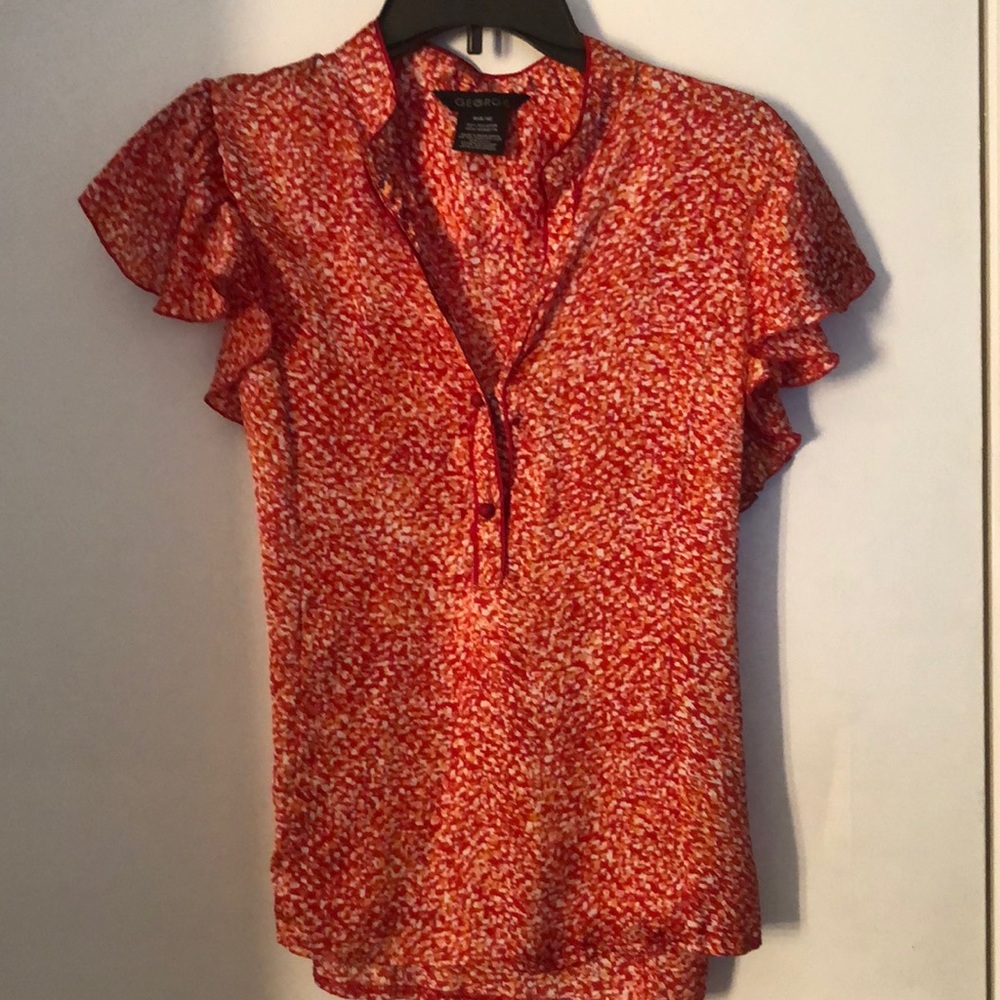 George orange, red and white top. Two buttons is front and tie in back